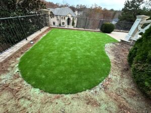 Tucano Stones - Artificial turf installation with curved organic shape - Johns Creek GA