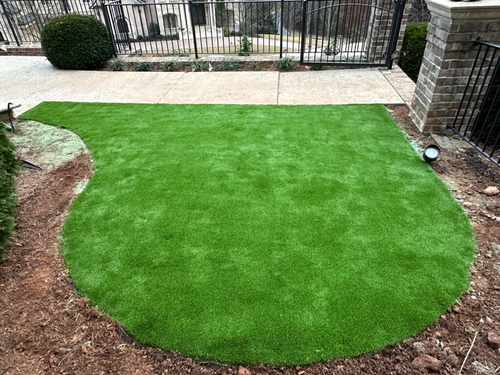 Tucano Stones - Artificial turf with paver edging detail - Johns Creek GA