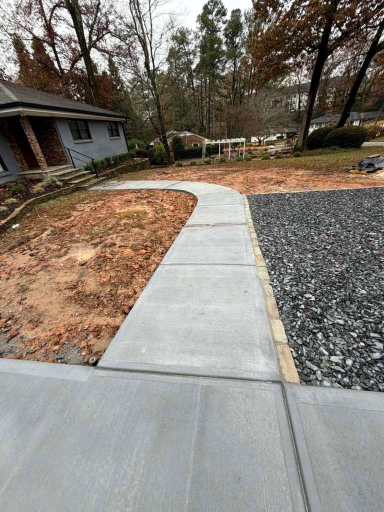 Tucano Stones - Curved concrete walkway with slate chip parking and cobblestone border - Atlanta GA