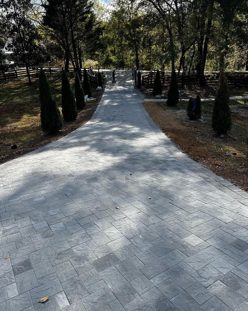 8000 sqft paver driveway with Belgard gray granite in the main and charcoal border.#paverdriveway