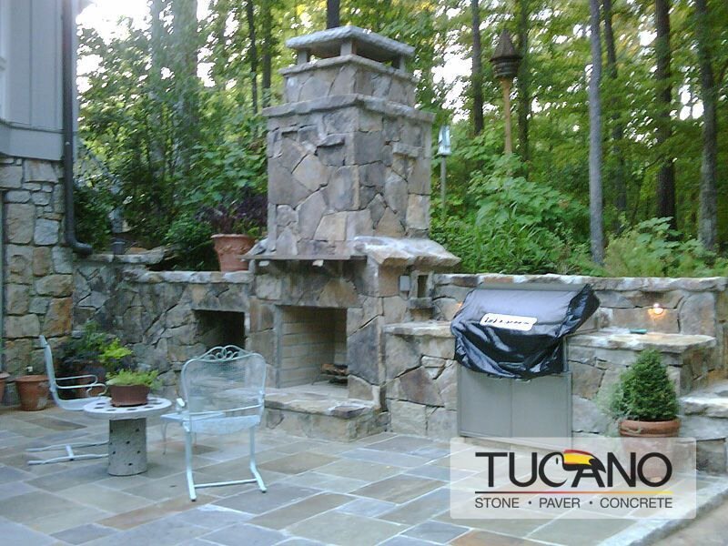 Natural stone outdoor kitchen and fireplace