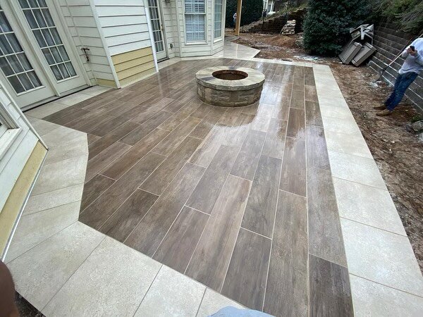 Porcelain patio with fire pit and fireplace in Roswell, GA