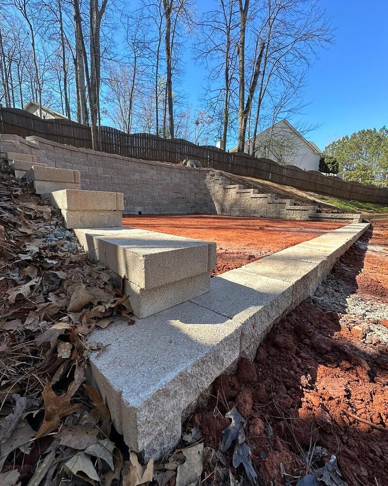 Retainning wall at a made up space for a swinging set.