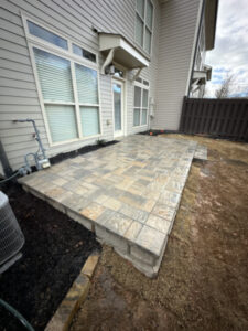 Tucano Stones Elevated paver patio with retaining wall block