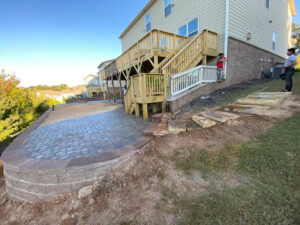 Tucano Stones Paver patio with seating wall, fire pit and stepping stones