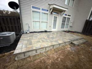 Tucano Stones Elevated paver patio with retaining wall block
